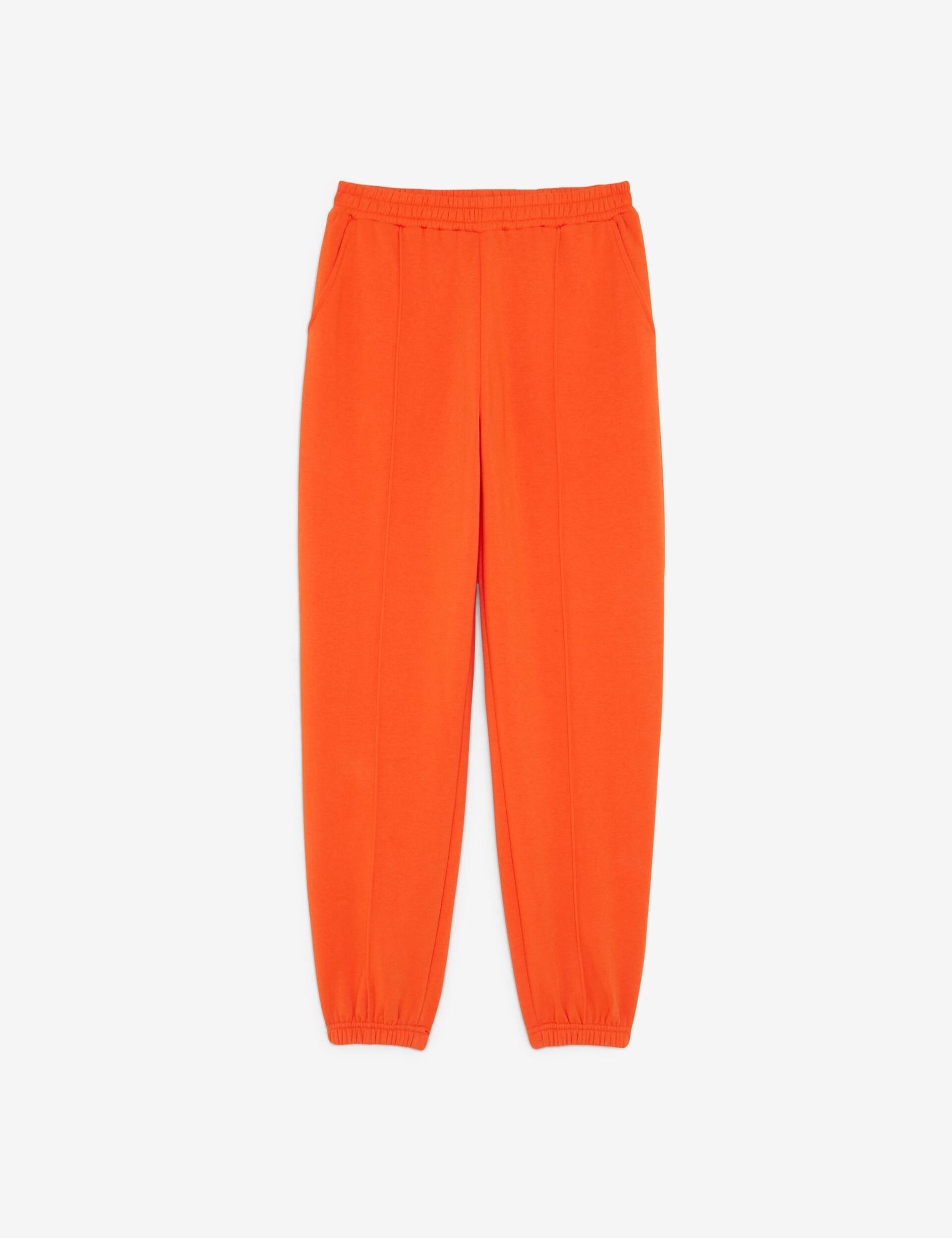 Jogging orange avec coutures apparentes