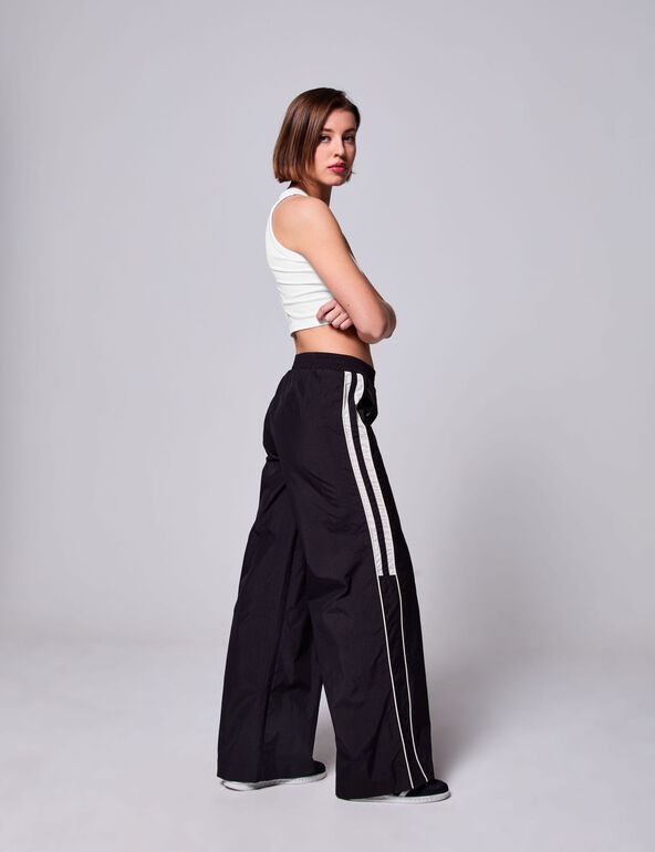 Pantalon zippé avec bandes blanches noir fille