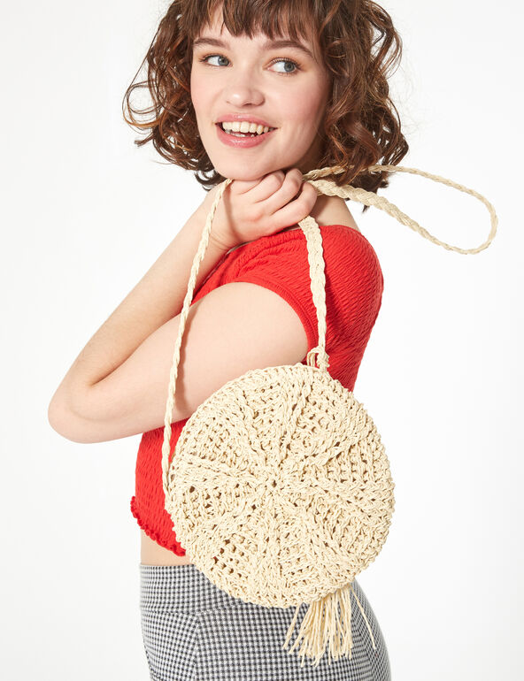 Beige round straw bag girl